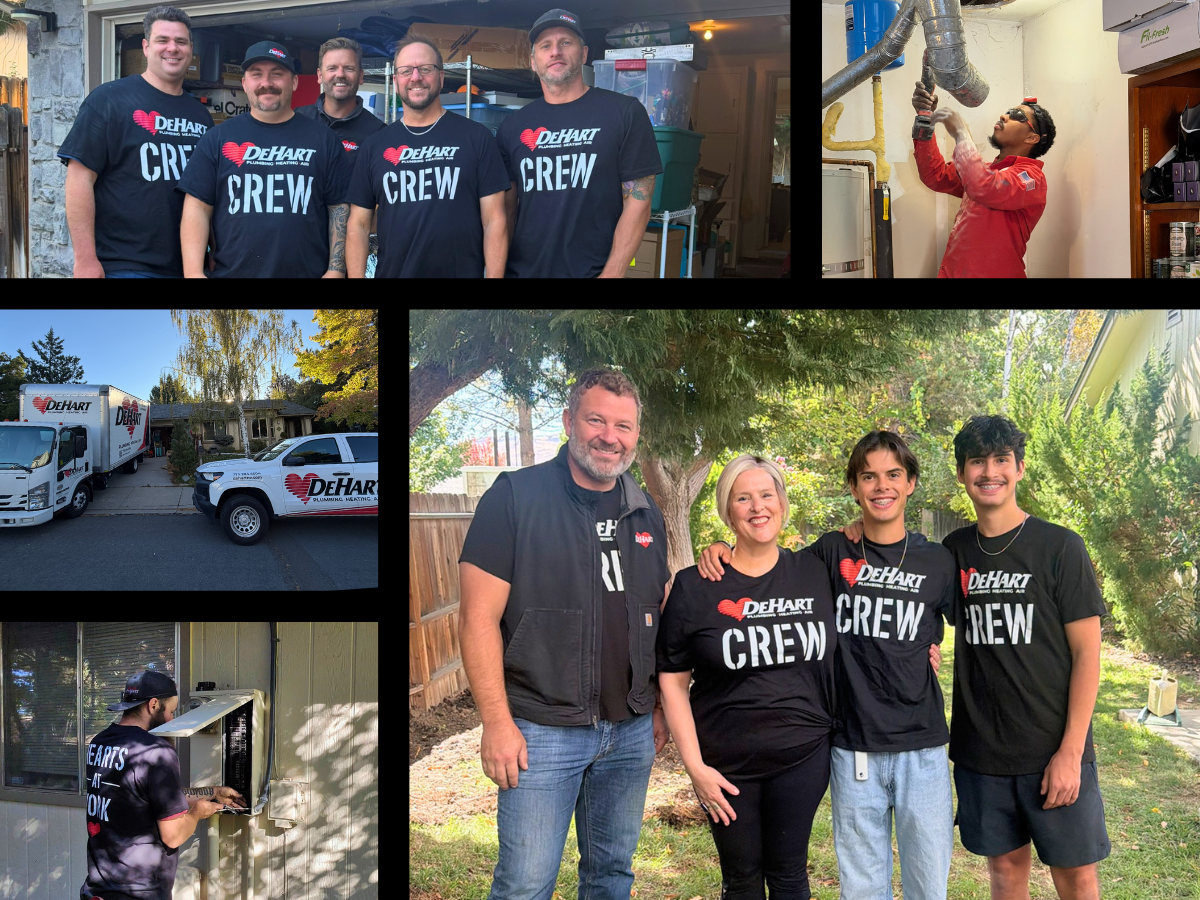 Dehart team photo in front of house with window