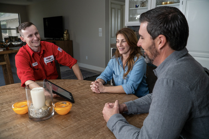 DeHart Technician Reviewing Tablet with Customers