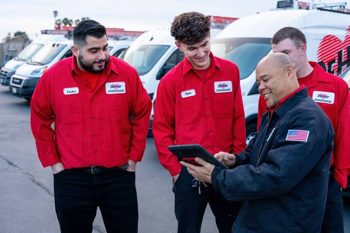 DeHart Technician Team Reviewing Tablet