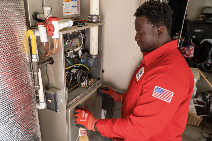 DeHart Technican Working on a Furance