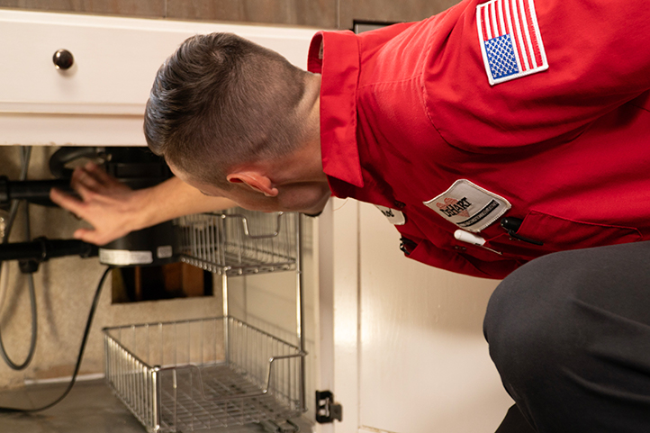 DeHart Technician Inspecting Plumbing