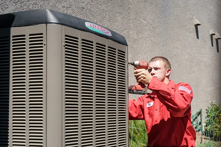 DeHart Technician Servicing a HVAC Unit
