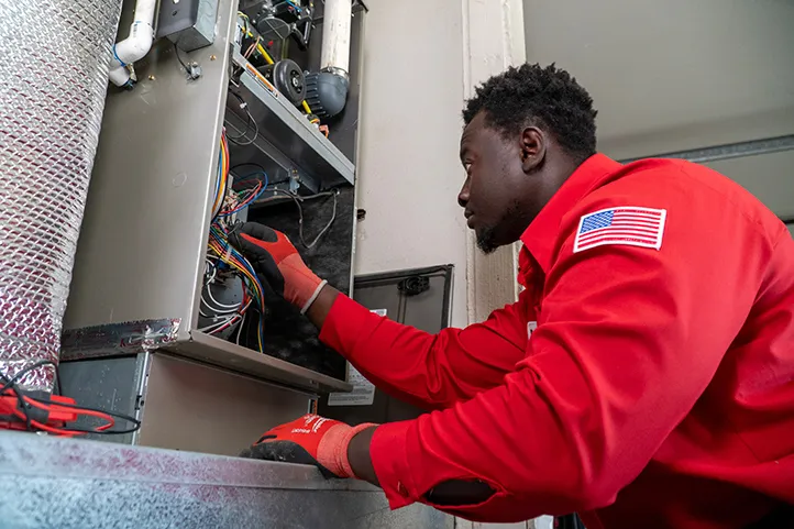 A Technician doing heating maintenance