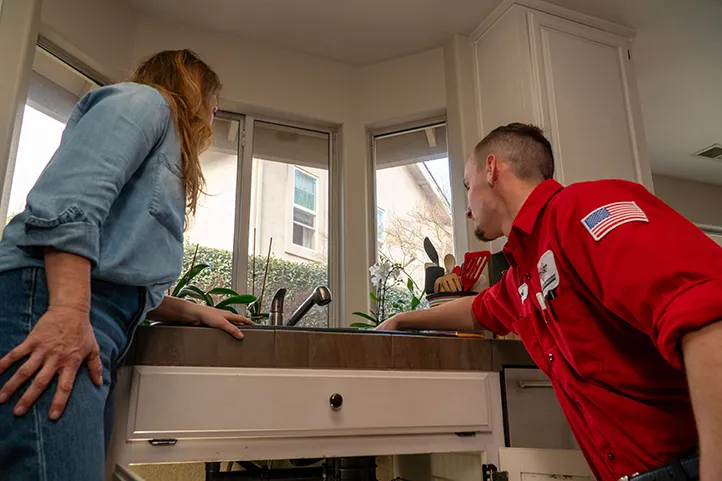 Dehart Technician doing kitchen plumbing service