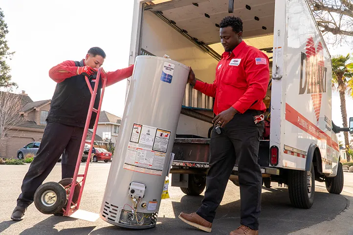 Dehart Technicians unloading a new Bradford White water heater