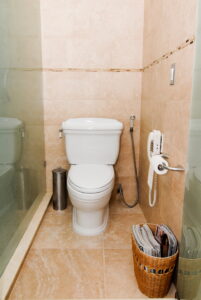 Clean bathroom with a toilet, often needing occasional drain cleaning or clogged drain service.